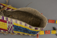 Lakota%20artist%2C%20%3Cb%3E%3Ci%3E%20Cradle%3C%2Fi%3E%3C%2Fb%3E%2C%20ca.%201890%2C%20aniline%20dyed%20porcupine%20quills%20on%20Native%20tanned%20deer%20hide%20with%20cotton%20bottom%2C%20The%20Elizabeth%20Cole%20Butler%20Collection%2C%20no%20known%20copyright%20restrictions%2C%2087.70.10